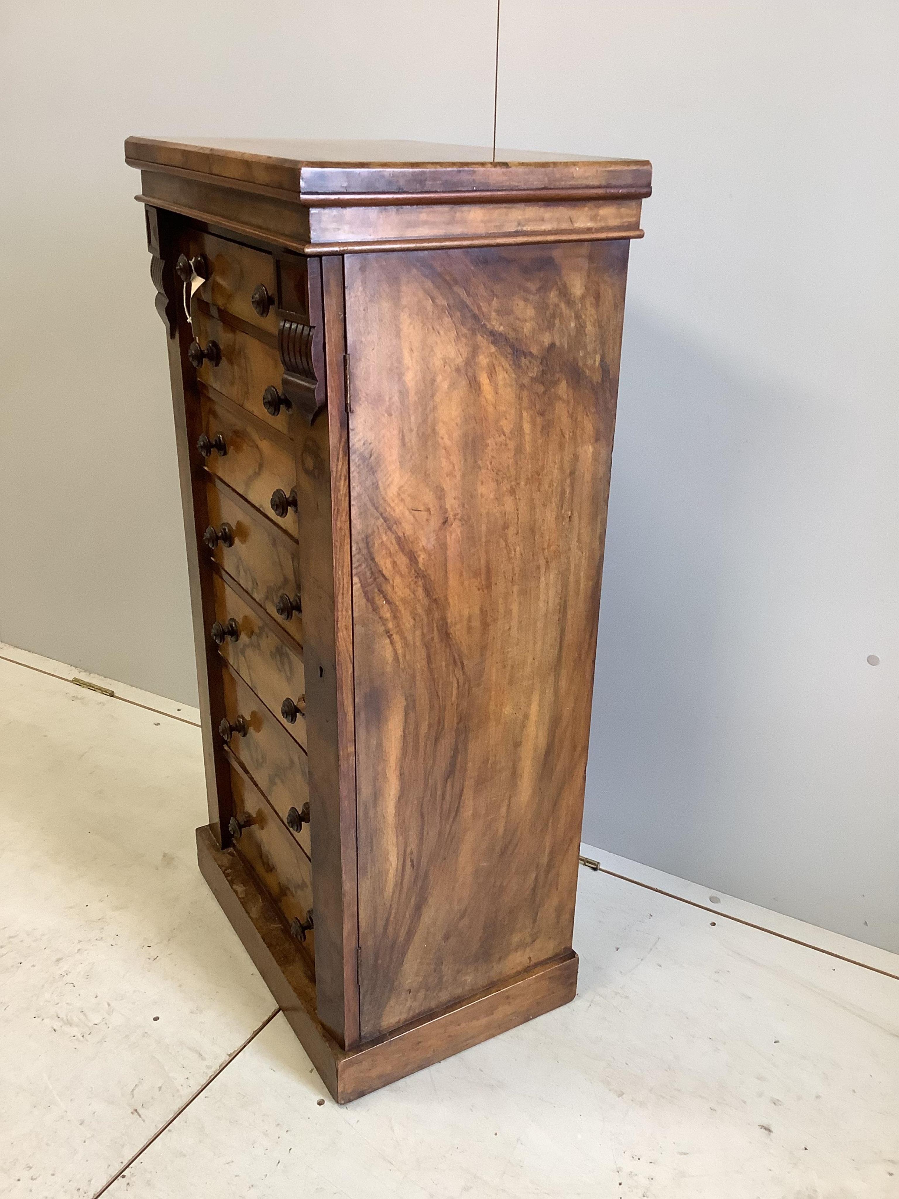 A Victorian walnut Wellington chest, width 52cm, depth 37cm, height 108cm. Condition - fair to good